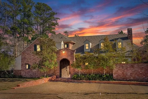 a front view of a house with yard