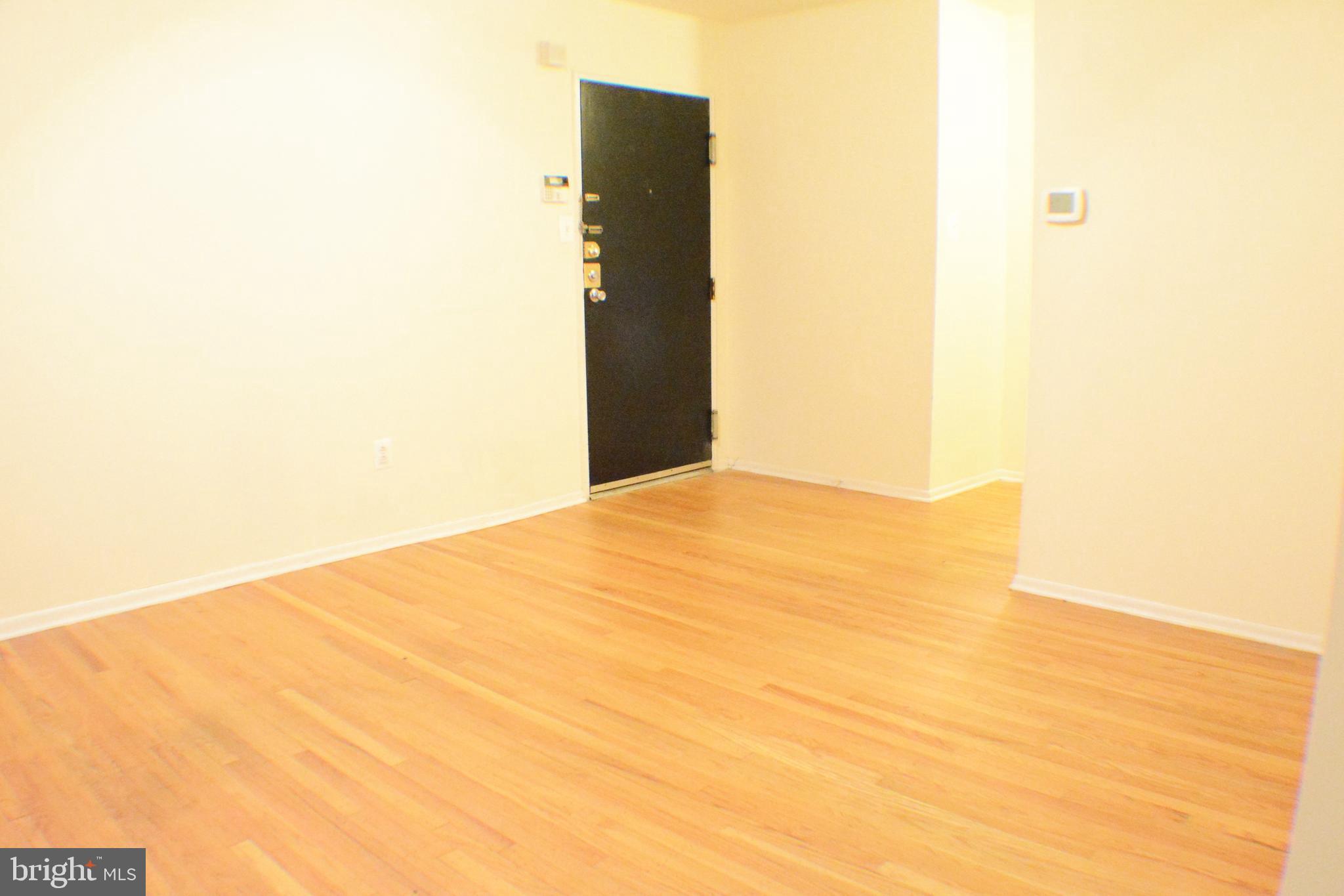 3411 Cresson Street, Unit 4 Philadelphia, PA 19129 - Photo 5 of 16 a view of a big room with windows