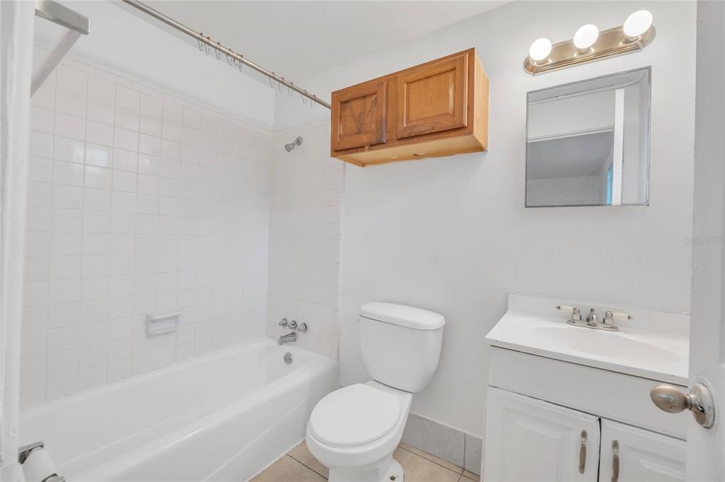 552 Fairmount Road Daytona Beach, FL 32114 - Photo 5 of 13 a white toilet sitting next to a bath tub