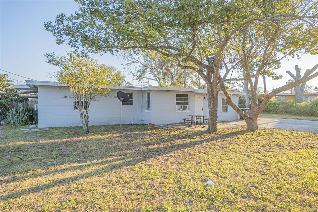 552 Fairmount Road Daytona Beach, FL 32114 - Photo 7 of 13 a house with trees in front of it