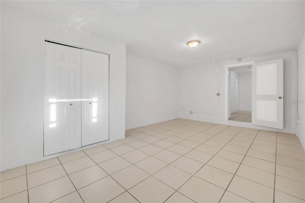 552 Fairmount Road Daytona Beach, FL 32114 - Photo 10 of 13 a view of an empty room and chandelier fan