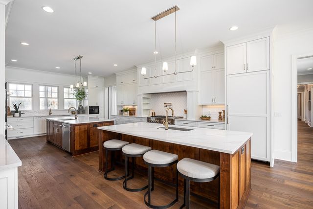 a living room with furniture a rug and white walls