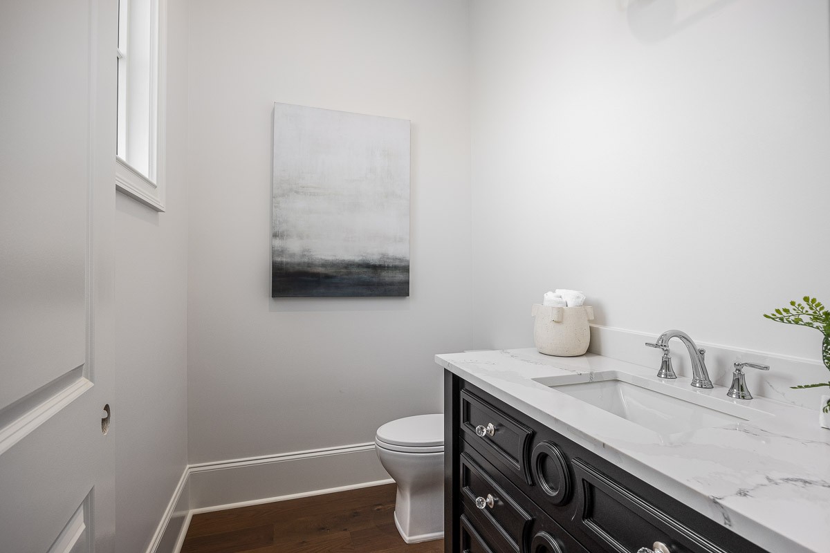 6876 Cross Keys Road College Grove, TN 37046 - Photo 26 of 99 a bathroom with a granite countertop sink a toilet and a mirror