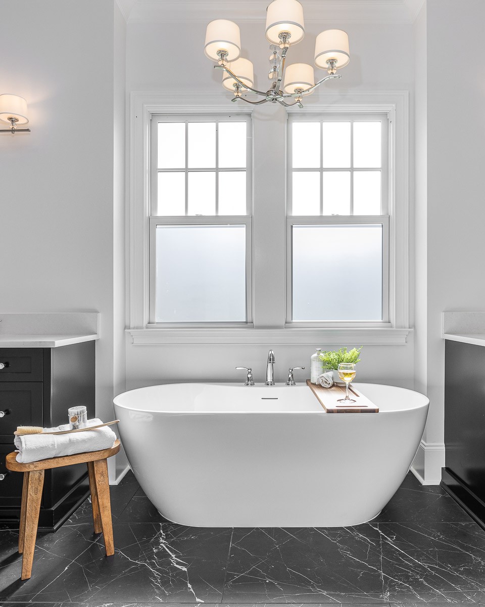 6876 Cross Keys Road College Grove, TN 37046 - Photo 30 of 99 a white bath tub sitting in a bathroom next to a window