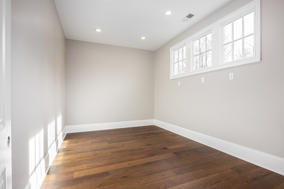 6876 Cross Keys Road College Grove, TN 37046 - Photo 33 of 99 an empty room with wooden floor and windows