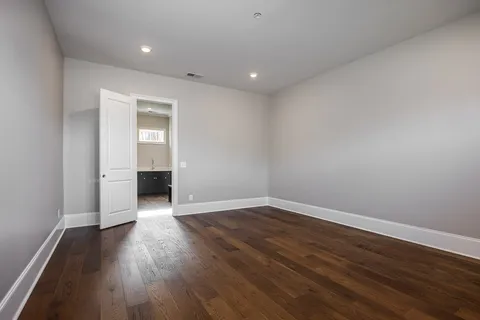 a living room with furniture a floor to ceiling window and a fireplace