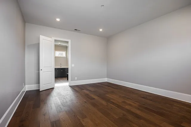 a living room with furniture a floor to ceiling window and a fireplace
