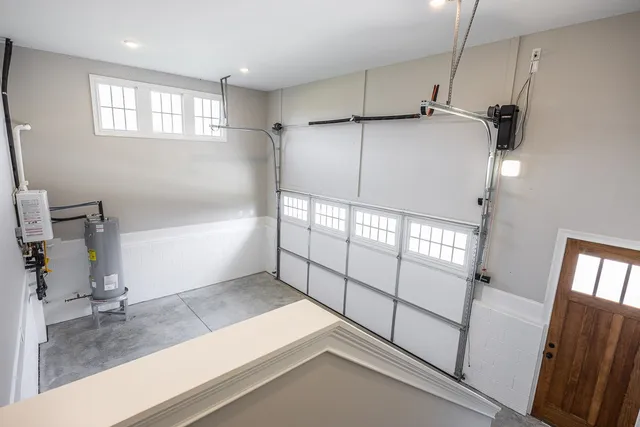 a view of a house with a big yard and large trees