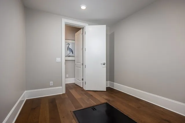 a kitchen with stainless steel appliances white cabinets and a refrigerator
