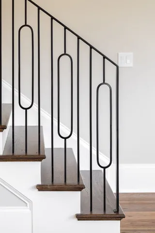 a view of entryway with wooden floor and windows
