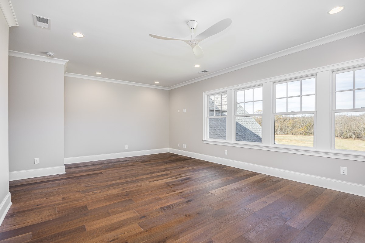 6876 Cross Keys Road College Grove, TN 37046 - Photo 48 of 99 an empty room with wooden floor and windows
