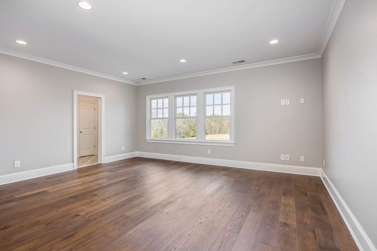 6876 Cross Keys Road College Grove, TN 37046 - Photo 55 of 99 wooden floor in an empty room with a window