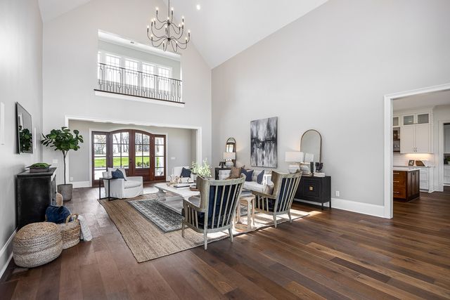 a kitchen with stainless steel appliances kitchen island granite countertop a refrigerator and a stove top oven