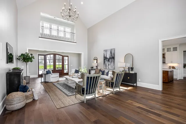 a kitchen with stainless steel appliances kitchen island granite countertop a refrigerator and a stove top oven