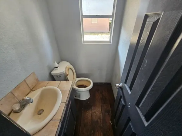 a close view of a sink and a washer and dryer