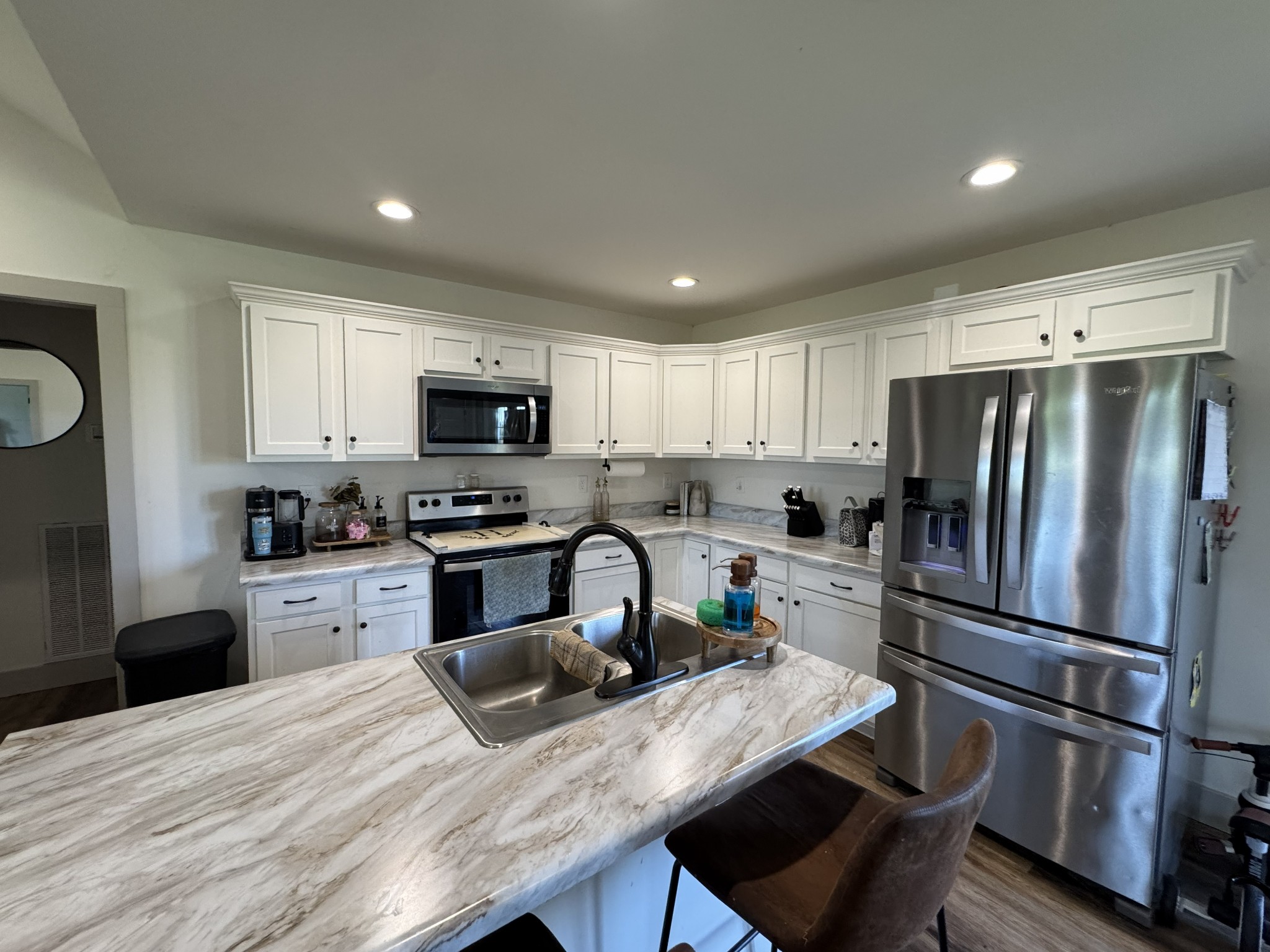 3130 Stokes Chapel Road Elkton, KY 42220 - Photo 5 of 15 a kitchen with granite countertop a refrigerator stove top oven and sink