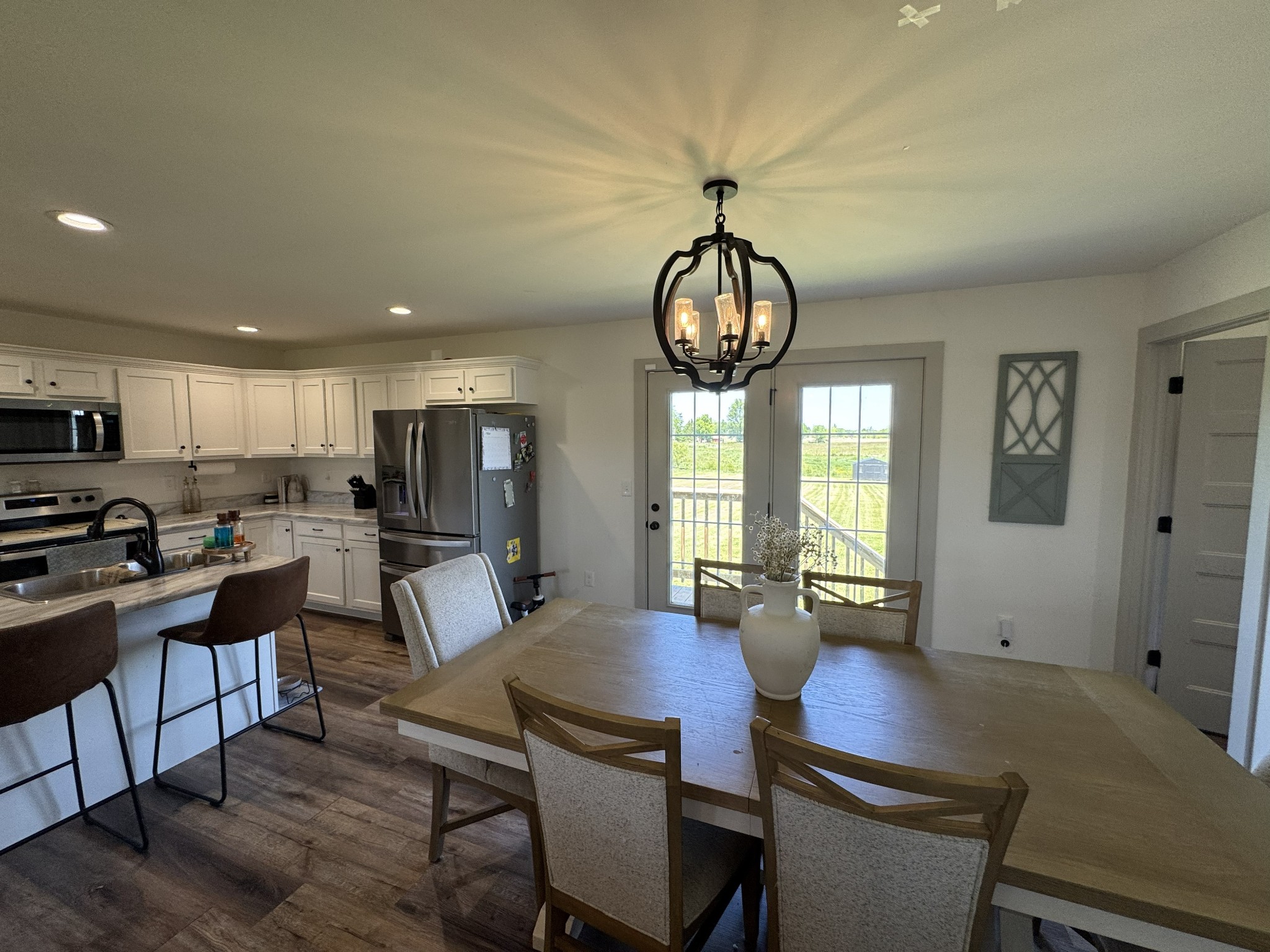 3130 Stokes Chapel Road Elkton, KY 42220 - Photo 6 of 15 a view of a dining room with furniture window and wooden floor