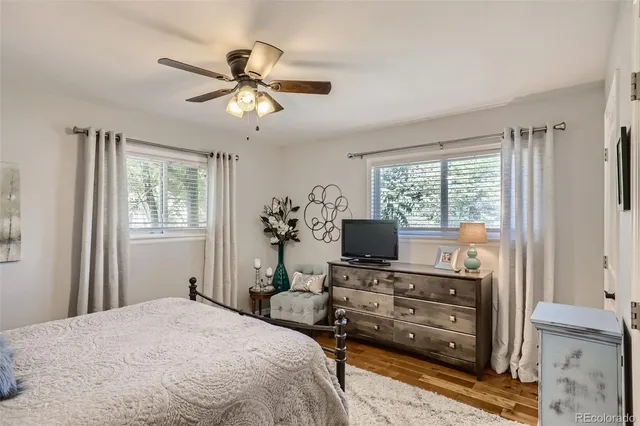 a bedroom with a bed and a television