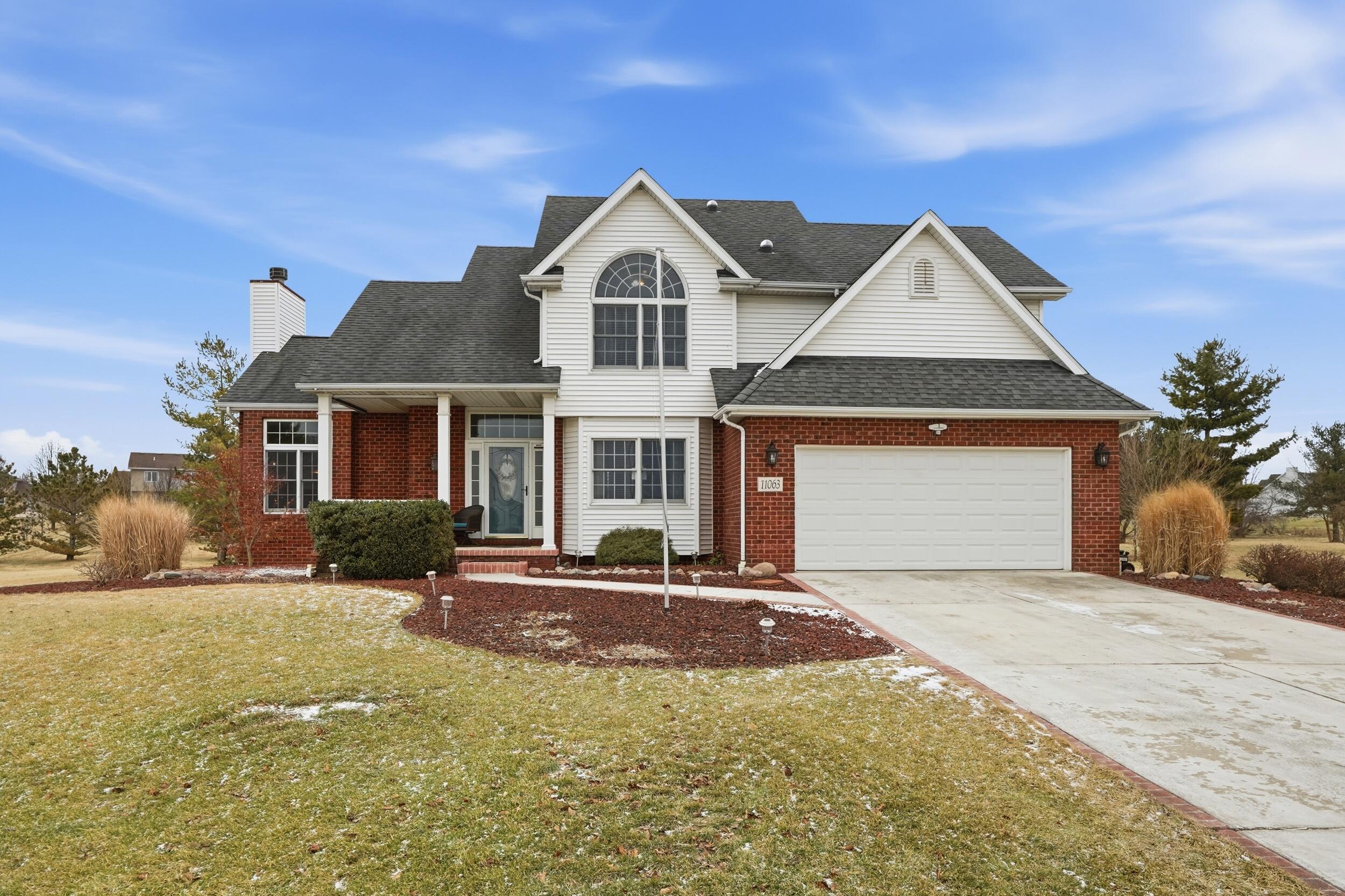 a front view of a house with a yard