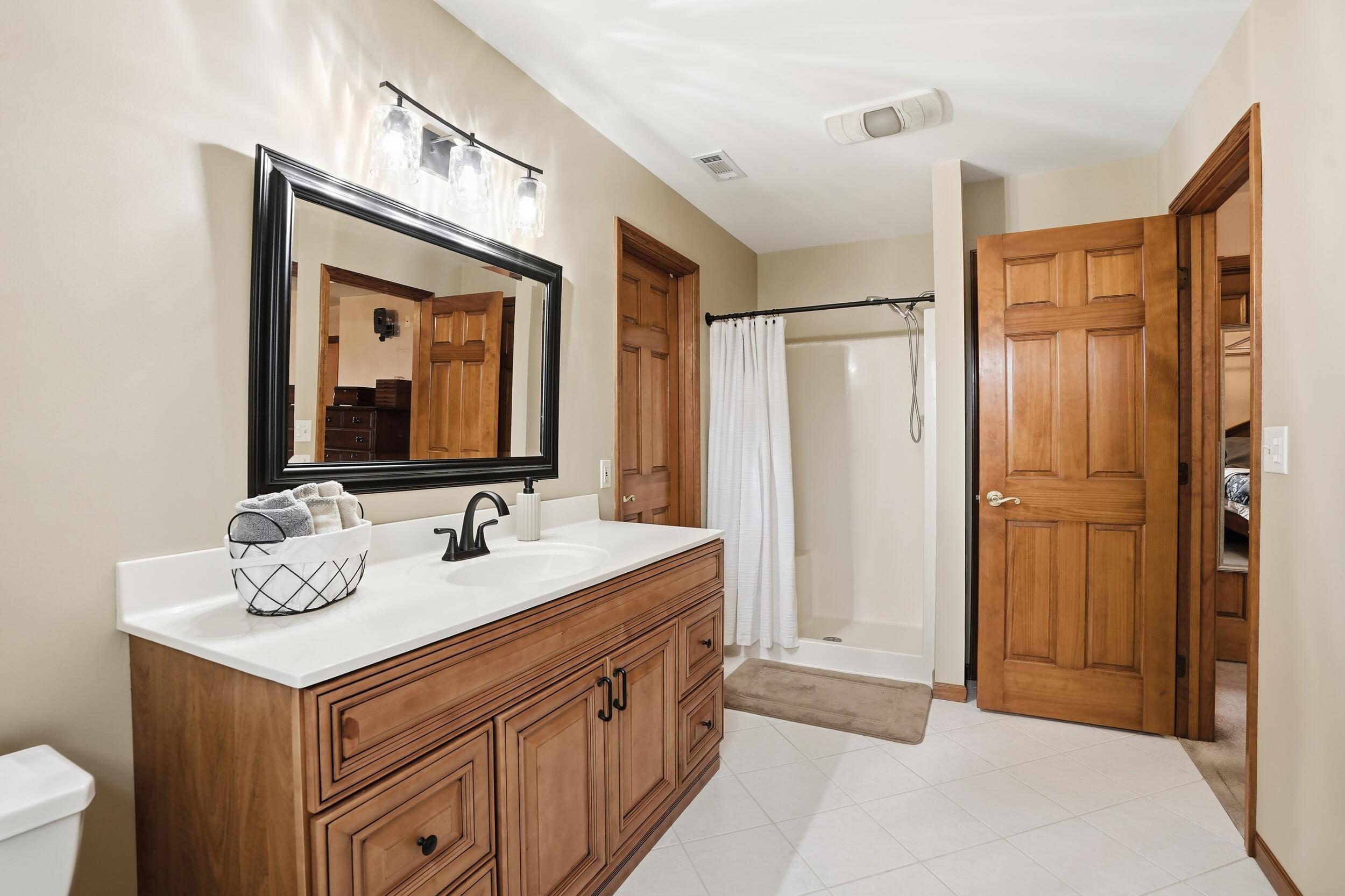 11063 Marion Place Crown Point, IN 46307 - Photo 12 of 22 a bathroom with a sink and a mirror