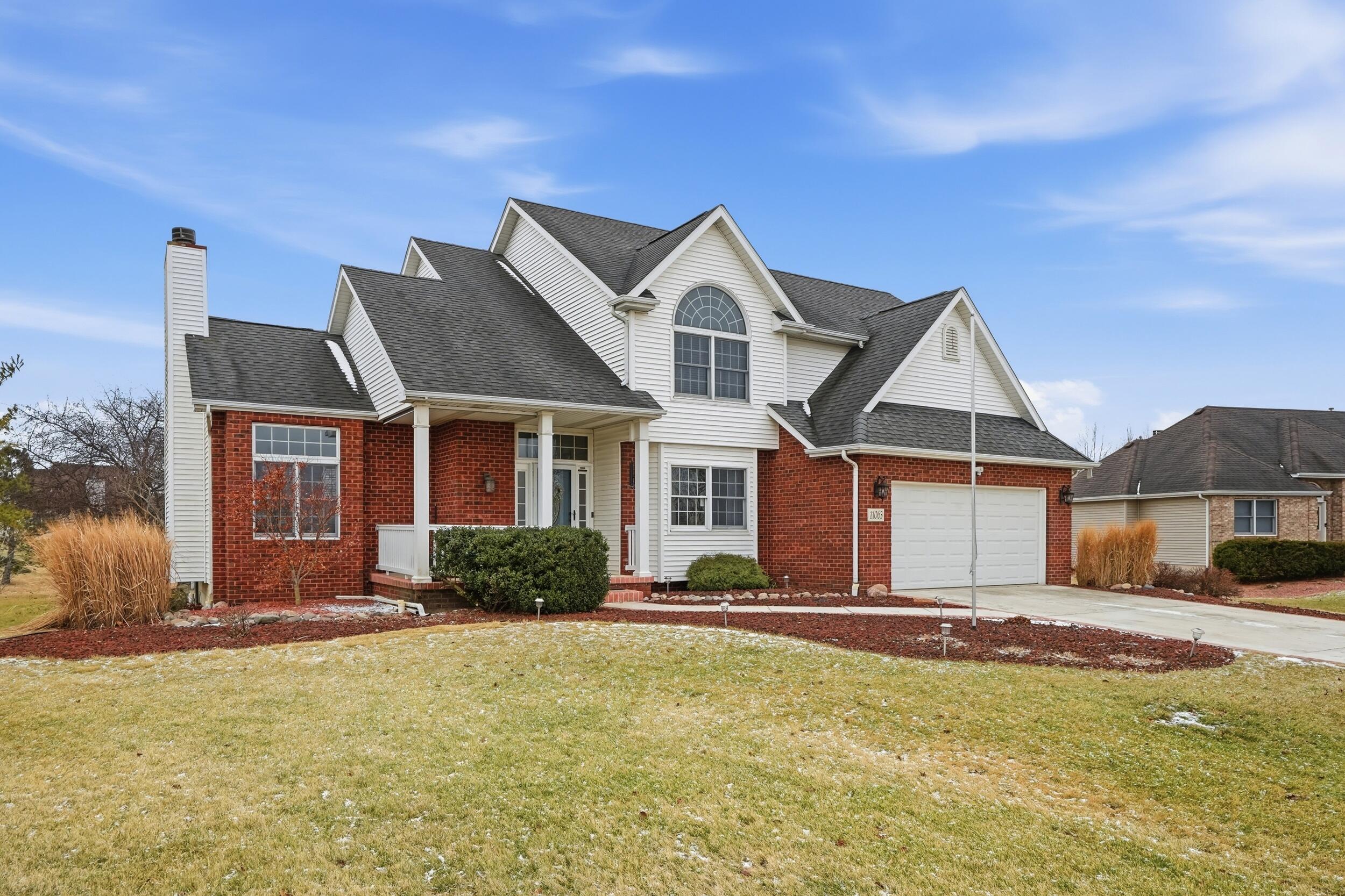 11063 Marion Place Crown Point, IN 46307 - Photo 2 of 22 a front view of a house with a yard