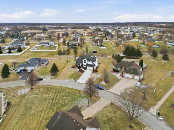 an aerial view of residential houses with outdoor space
