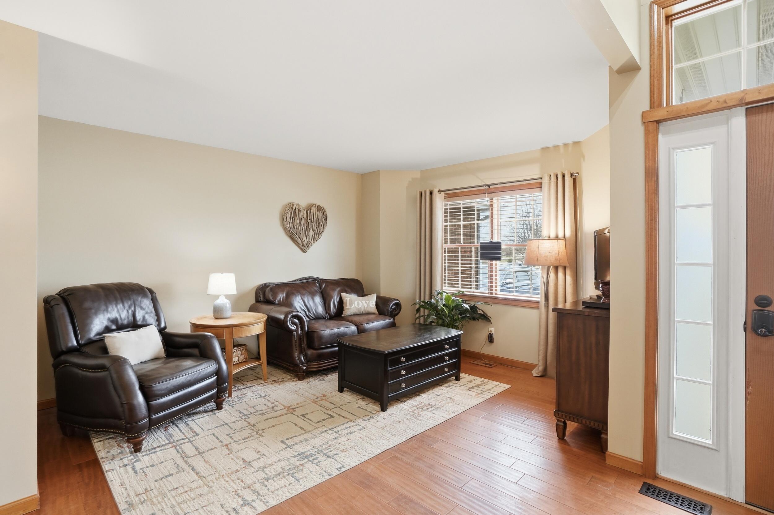 11063 Marion Place Crown Point, IN 46307 - Photo 7 of 22 a living room with furniture rug and wooden floor