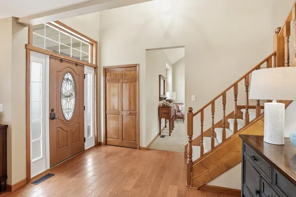 a view of an entryway with wooden floor