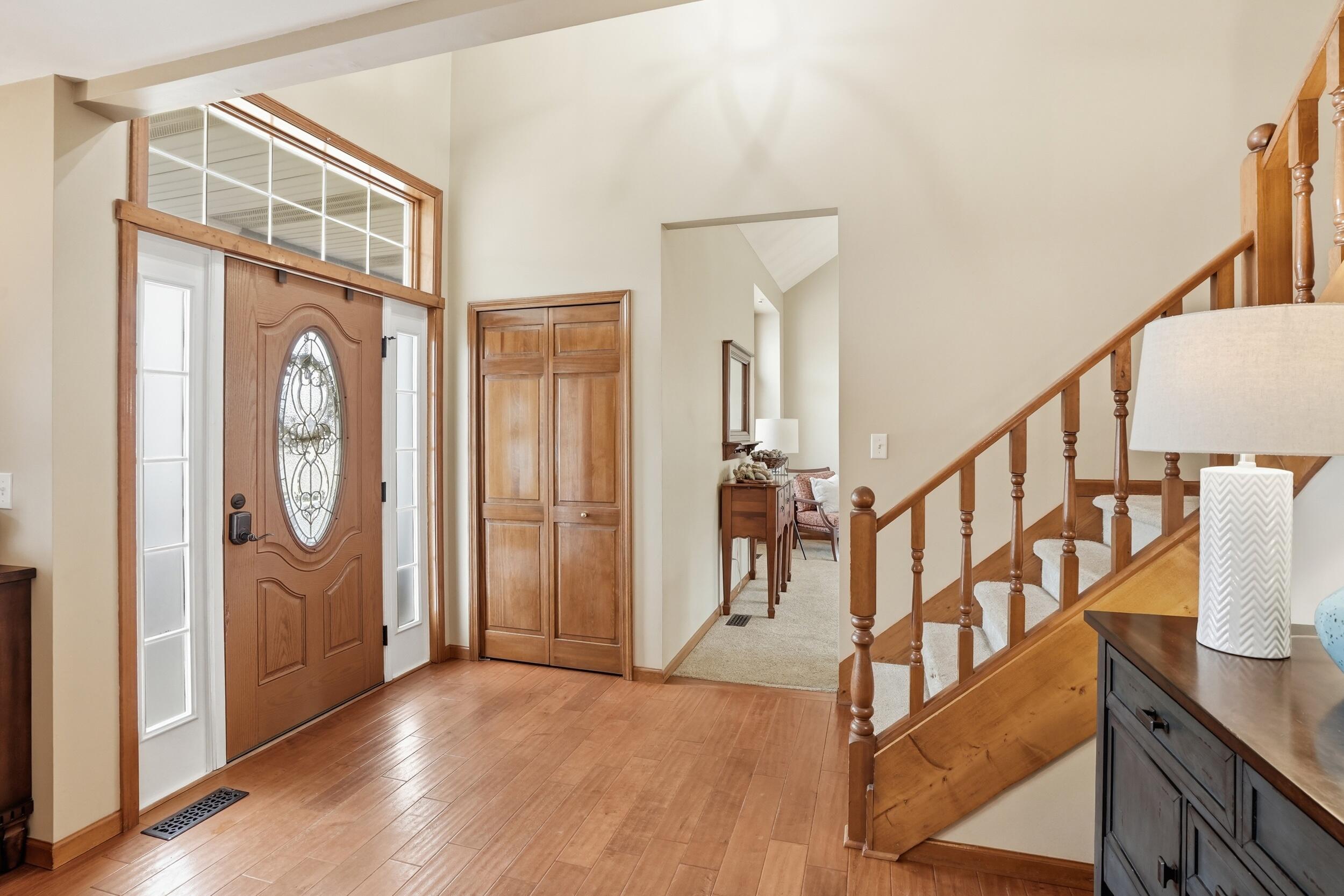 11063 Marion Place Crown Point, IN 46307 - Photo 8 of 22 a view of an entryway with wooden floor