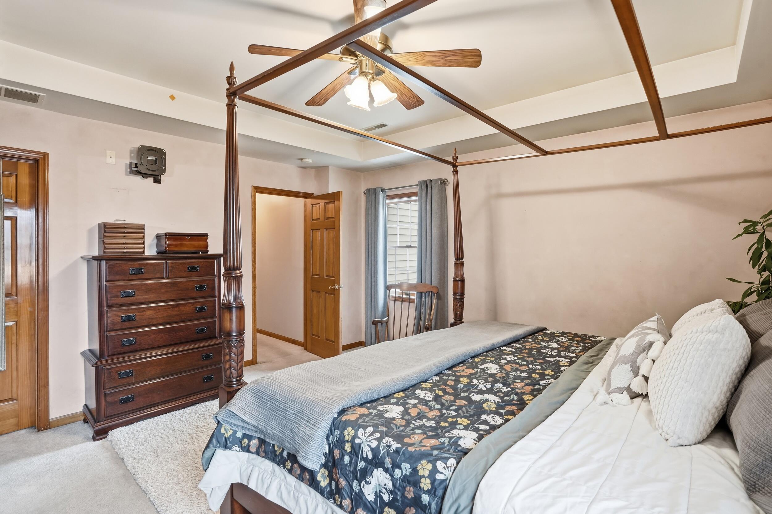 11063 Marion Place Crown Point, IN 46307 - Photo 10 of 22 a bedroom with a bed and a mirror