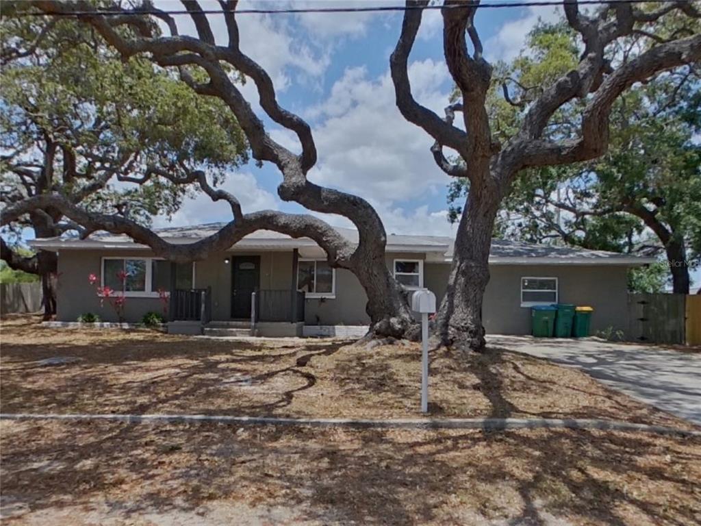 a view of a house with a yard