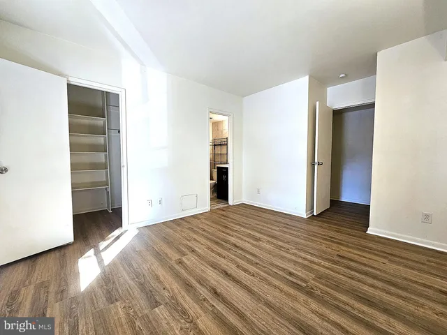 a view of a livingroom with wooden floor and closet
