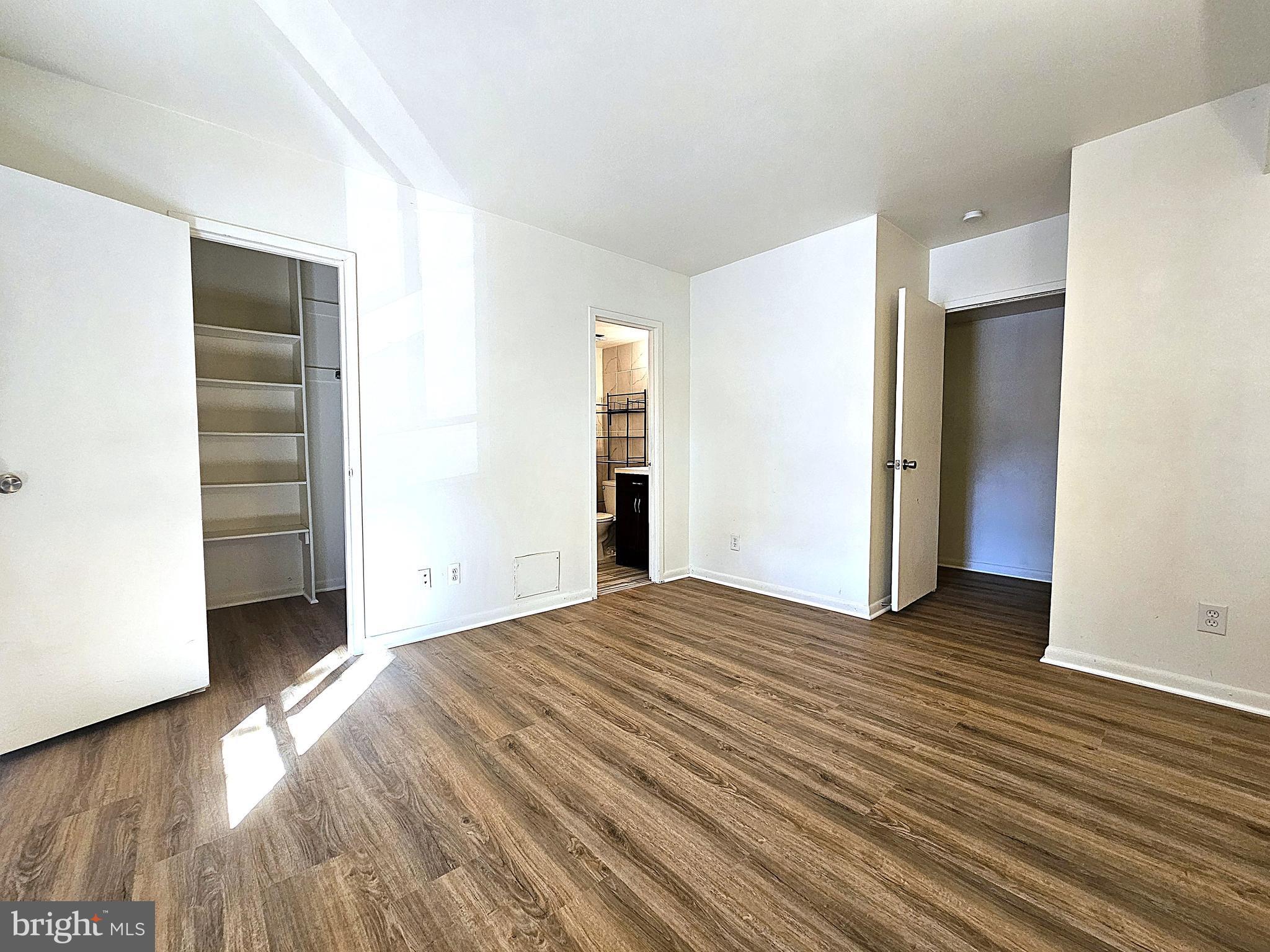 2239 Castle Rock Square, Unit 21C Reston, VA 20191 - Photo 14 of 30 a view of a livingroom with wooden floor and closet