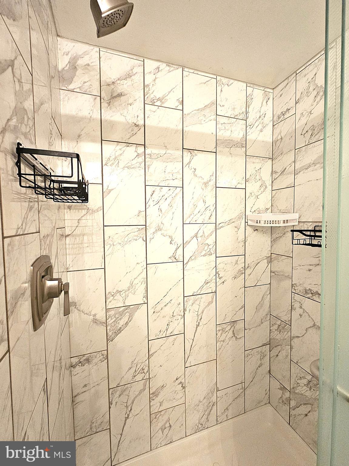 2239 Castle Rock Square, Unit 21C Reston, VA 20191 - Photo 16 of 30 a bathroom with a shower