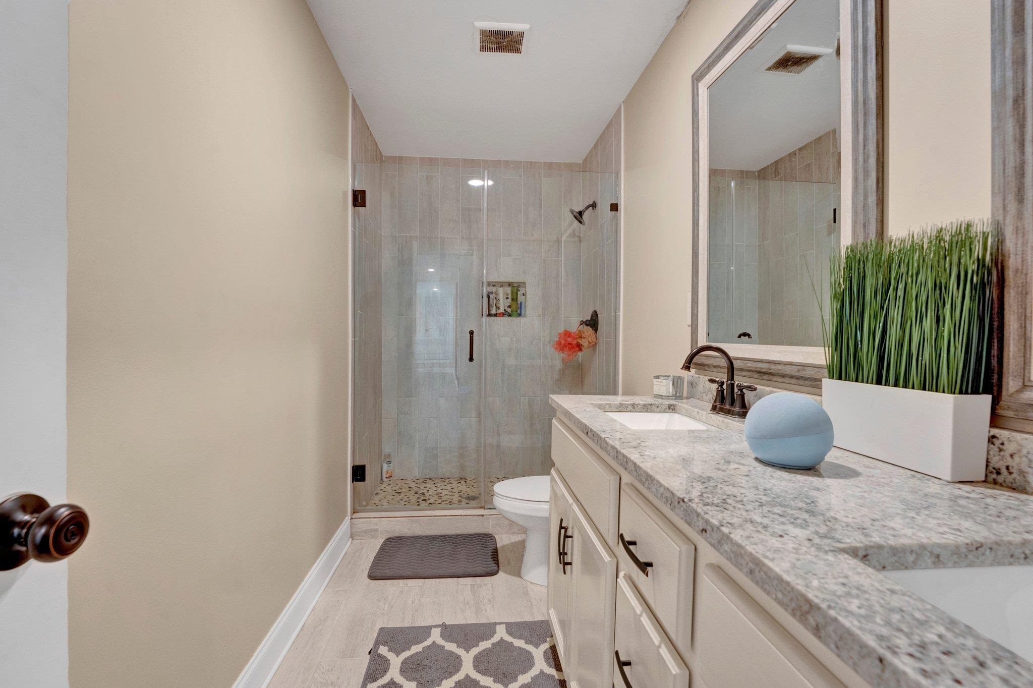 3270 Rast Road Millington, TN 38053 - Photo 31 of 40 Bathroom with a shower stall, double vanity, and light wood-style flooring