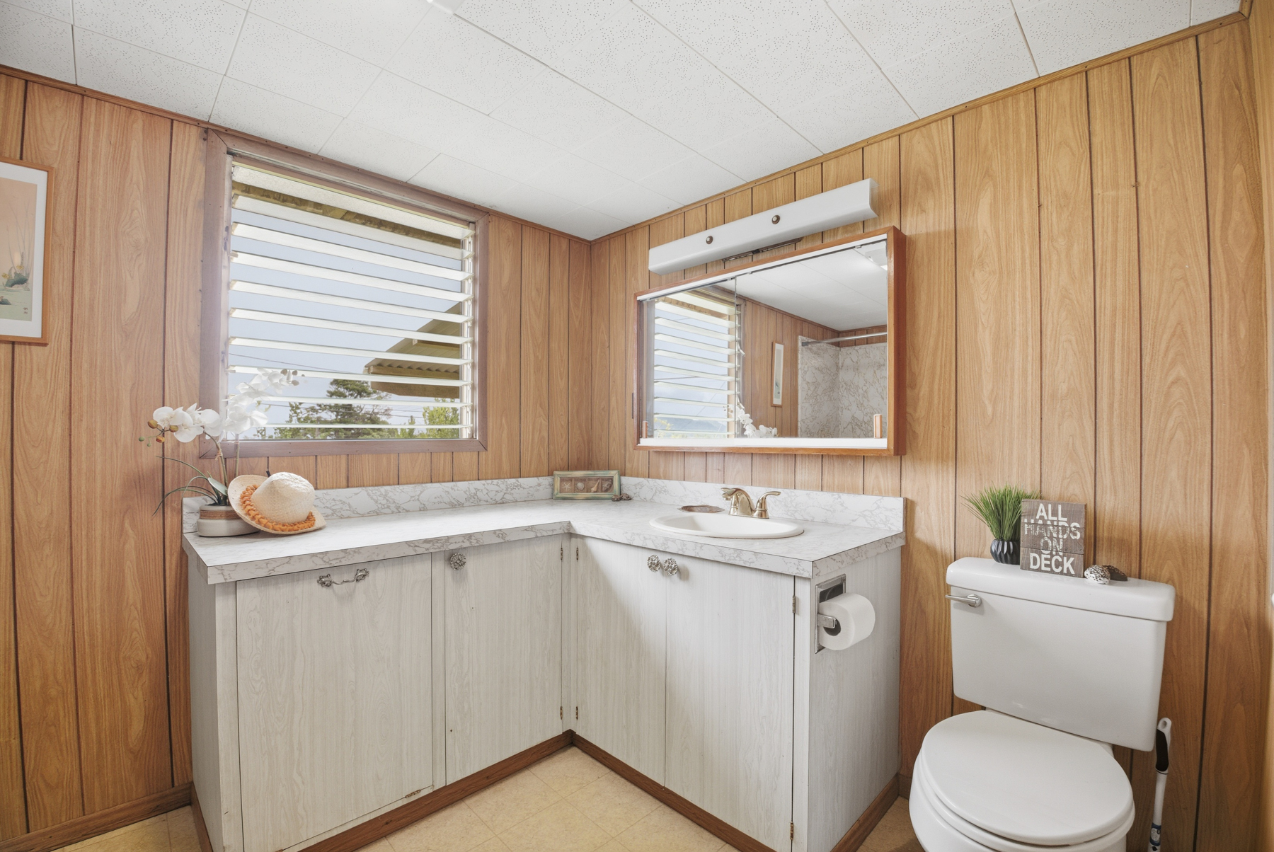 4069 Koloa Road Koloa, HI 96756 - Photo 11 of 23 a bathroom with a toilet sink and mirror