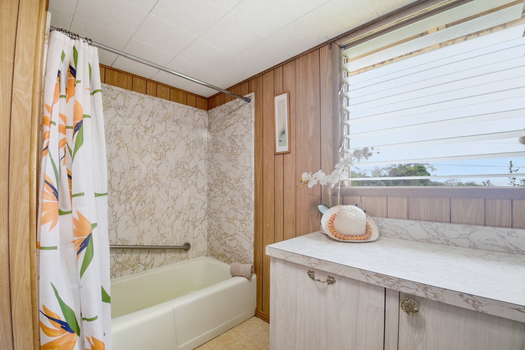 4069 Koloa Road Koloa, HI 96756 - Photo 12 of 23 a bathroom with a tub and a shower curtain