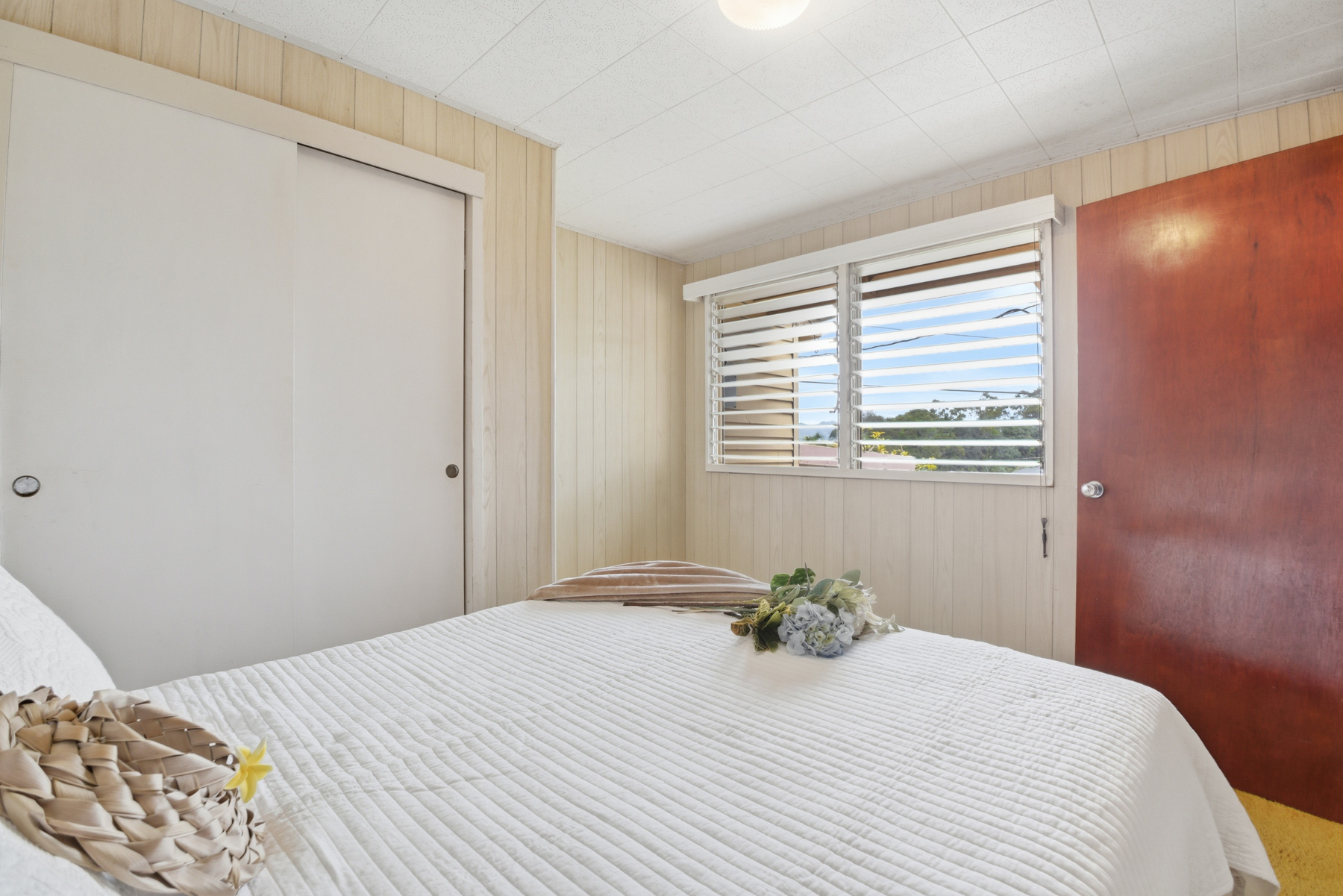 4069 Koloa Road Koloa, HI 96756 - Photo 9 of 23 a bedroom with a bed and a window