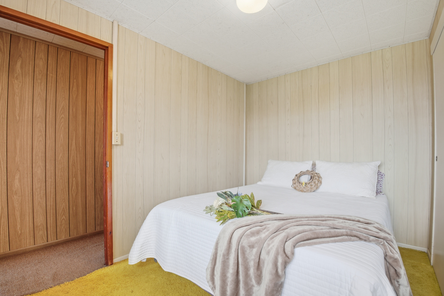 4069 Koloa Road Koloa, HI 96756 - Photo 10 of 23 a bedroom with a bed and wooden floor