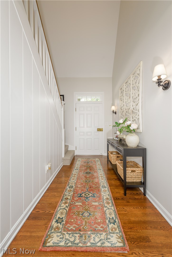 2447 Covington Road Akron, OH 44313 - Photo 8 of 46 Large entryway featuring lofted ceiling and hardwood flooring
