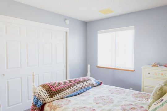 1112 Lee Avenue Ridgecrest, CA 93555 - Photo 22 of 29 a bedroom with a bed and a window