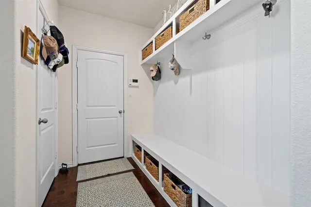 a view of an entryway with wooden floor