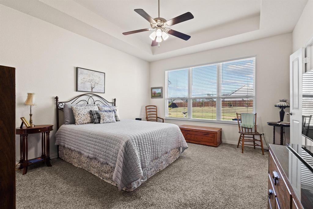 1875 Whitemound Road Sherman, TX 75090 - Photo 19 of 40 a bedroom with a bed and a large window with the outer view