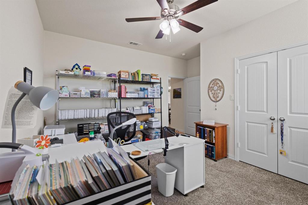 1875 Whitemound Road Sherman, TX 75090 - Photo 26 of 40 a bedroom with furniture and a chandelier fan