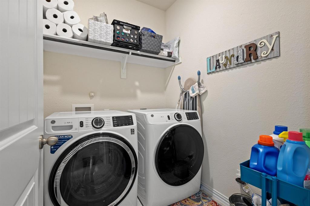 1875 Whitemound Road Sherman, TX 75090 - Photo 30 of 40 a utility room with dryer and washer