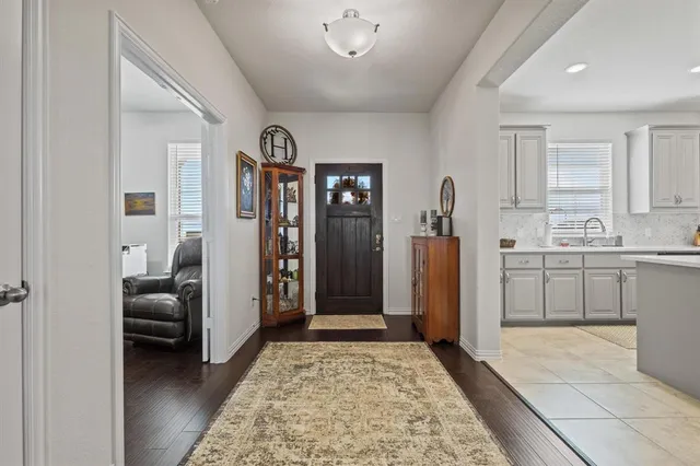 a view of living room with furniture and a rug
