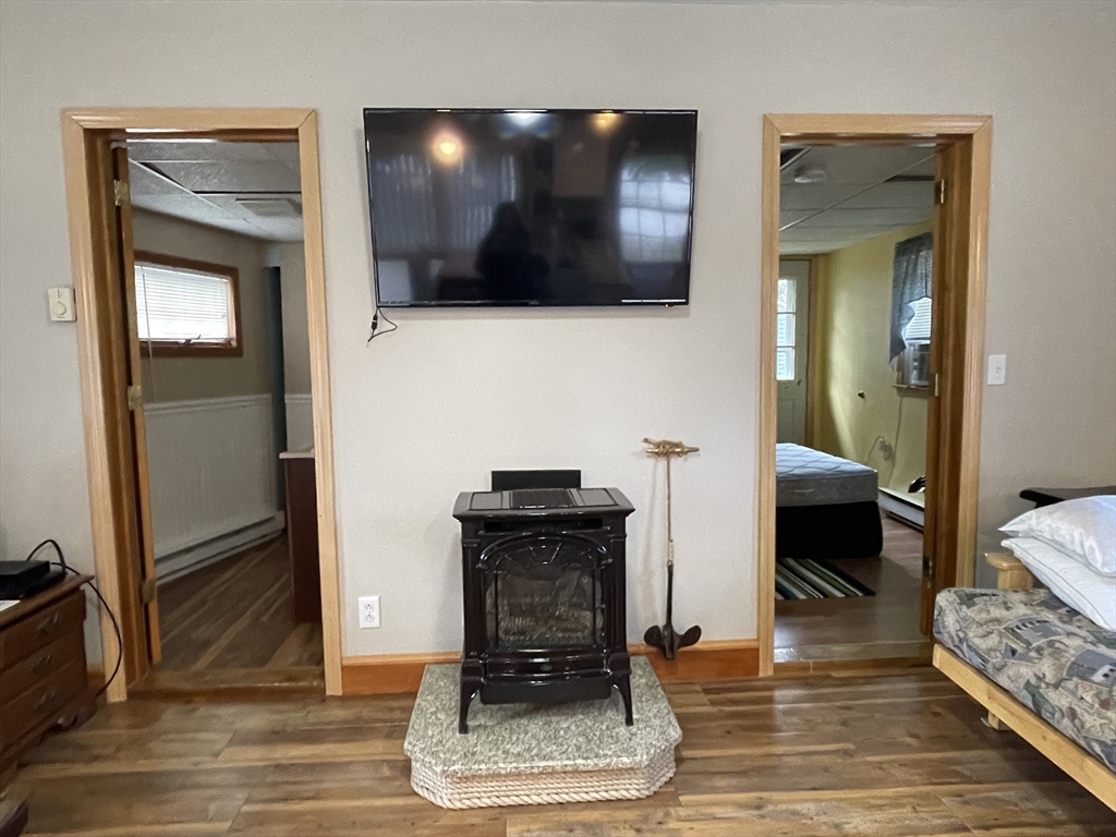 1634 Drift Road, Unit T Westport, MA 02790 - Photo 11 of 18 a living room with furniture and a flat screen tv
