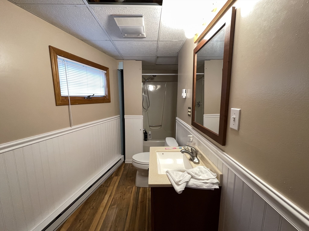 1634 Drift Road, Unit T Westport, MA 02790 - Photo 12 of 18 a bathroom with a sink and a mirror