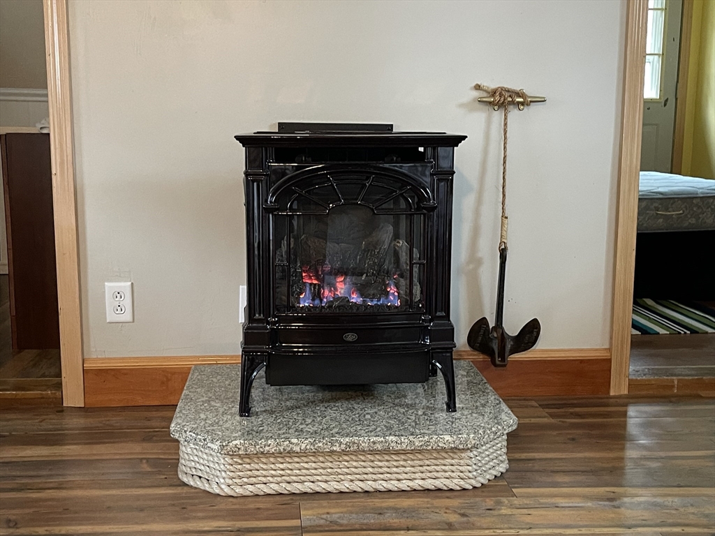 1634 Drift Road, Unit T Westport, MA 02790 - Photo 13 of 18 a living room with furniture and a fireplace