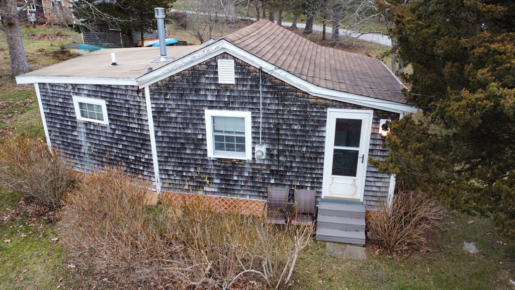 1634 Drift Road, Unit T Westport, MA 02790 - Photo 3 of 18 a front view of a house with a yard